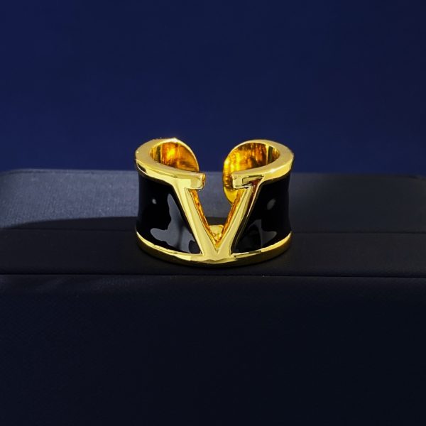 Valentino open-ended ring with a perforated V logo in white and black dripping